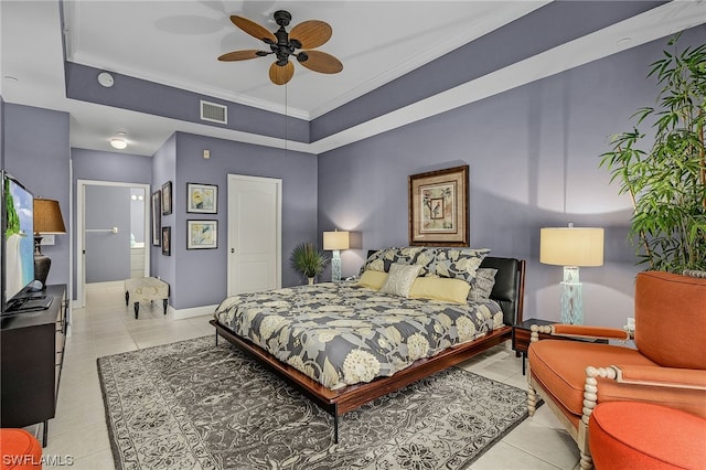 tiled bedroom featuring ensuite bath, ceiling fan, and crown molding