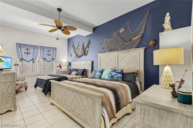 tiled bedroom featuring ceiling fan