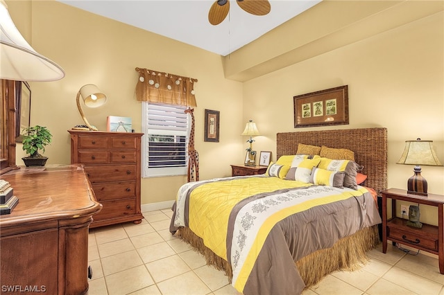 bedroom with ceiling fan and light tile patterned floors