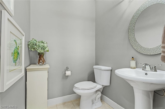 bathroom featuring tile patterned flooring and toilet