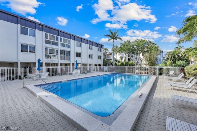 view of swimming pool featuring a patio area