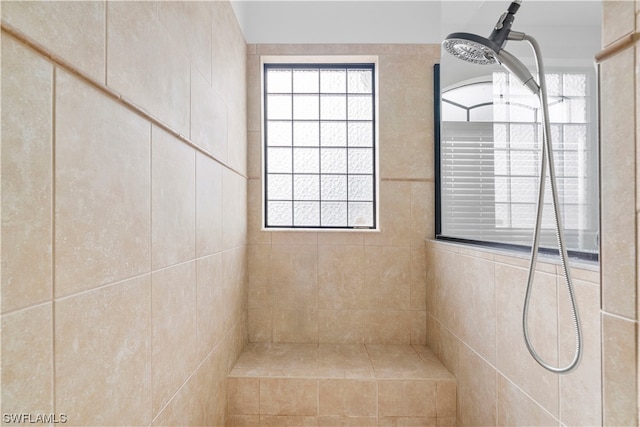 bathroom featuring a tile shower