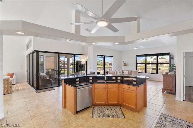 kitchen featuring sink, ceiling fan, dishwasher, and a wealth of natural light