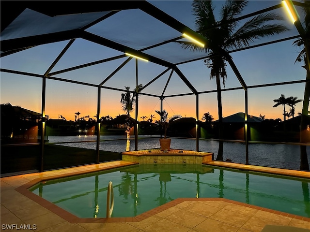 pool at dusk with glass enclosure