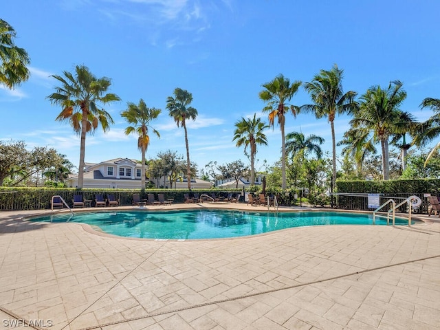 view of swimming pool with a patio area