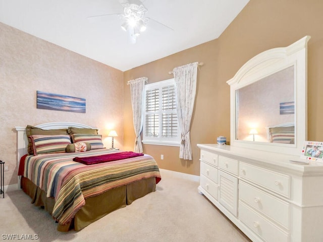 bedroom with light carpet and ceiling fan