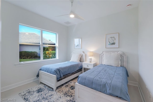 bedroom with multiple windows and ceiling fan