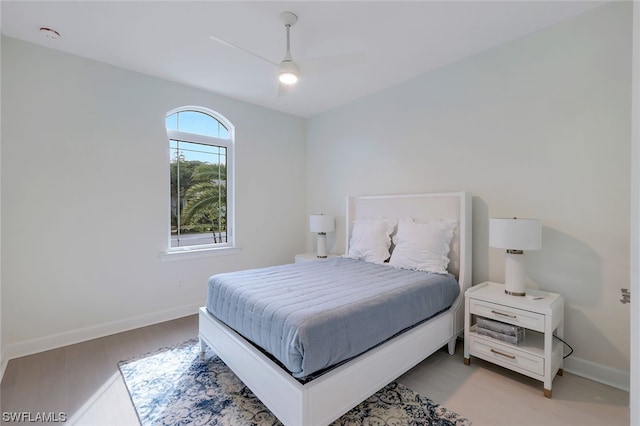 bedroom featuring light hardwood / wood-style floors and ceiling fan