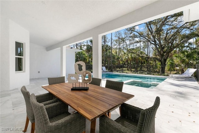 exterior space featuring a fenced in pool, outdoor dining area, fence, and an in ground hot tub