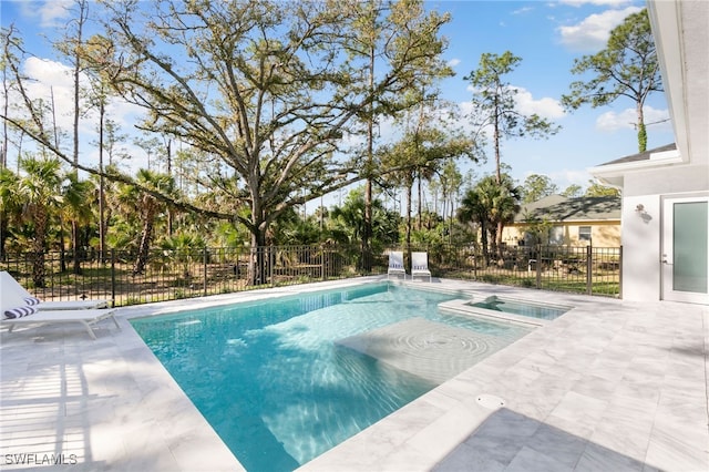 view of swimming pool featuring a patio, fence, and a fenced in pool