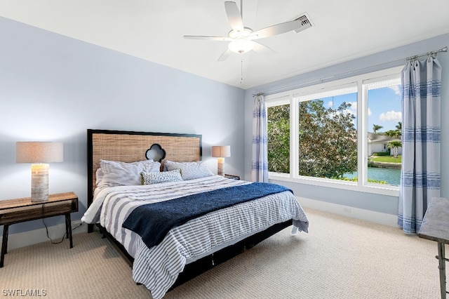 bedroom with light colored carpet and ceiling fan