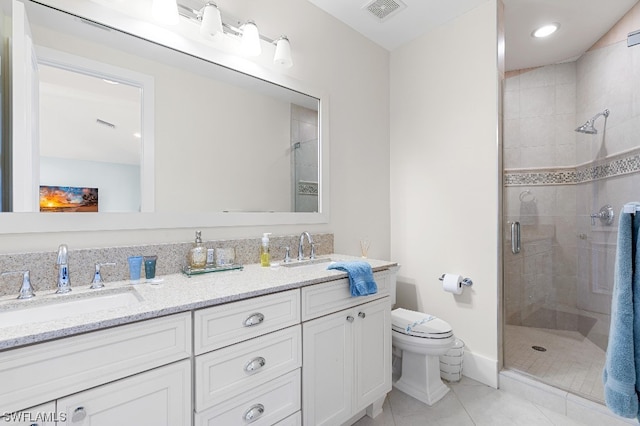 bathroom with an enclosed shower, double vanity, toilet, and tile flooring