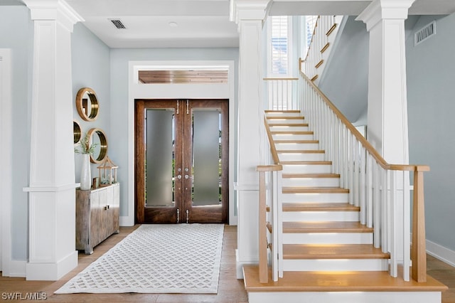 foyer with french doors and ornate columns