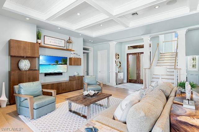 living room with coffered ceiling, decorative columns, beamed ceiling, light hardwood / wood-style flooring, and ornamental molding