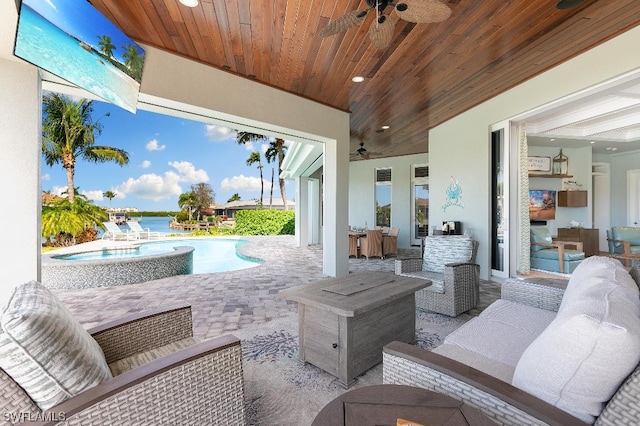 view of terrace featuring a pool with hot tub, ceiling fan, and an outdoor hangout area