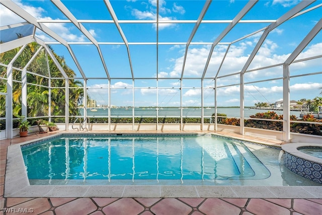 view of swimming pool featuring a patio area, a jacuzzi, and a lanai