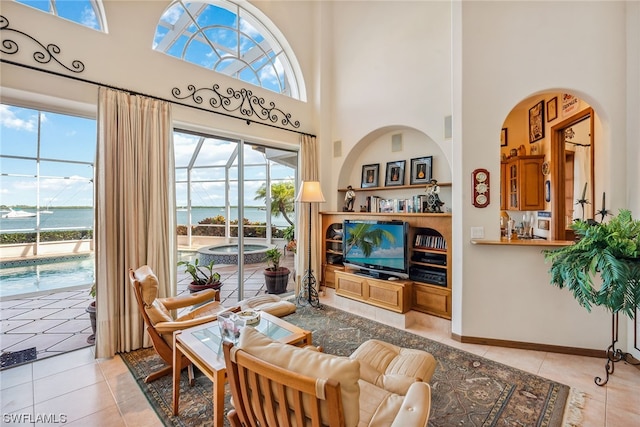 living room with plenty of natural light and light tile flooring