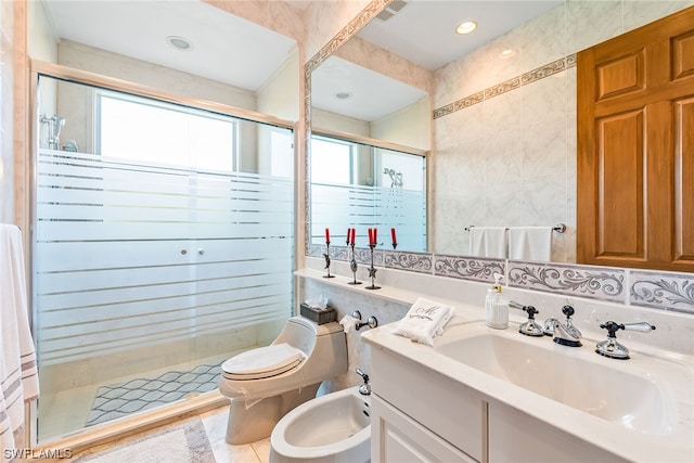 bathroom with an enclosed shower, vanity, tile walls, toilet, and a bidet