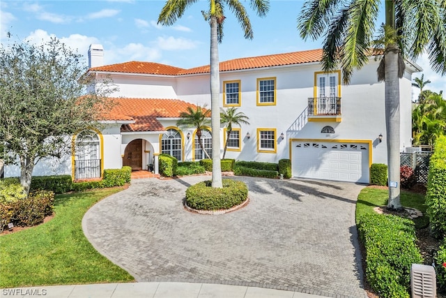 mediterranean / spanish-style home featuring a garage