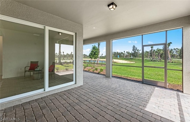 unfurnished sunroom featuring a wealth of natural light