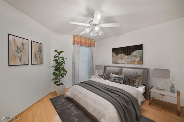 bedroom featuring wood-type flooring and ceiling fan