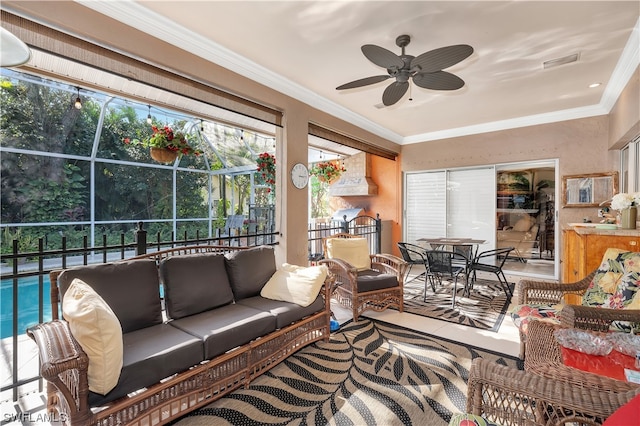 sunroom with ceiling fan