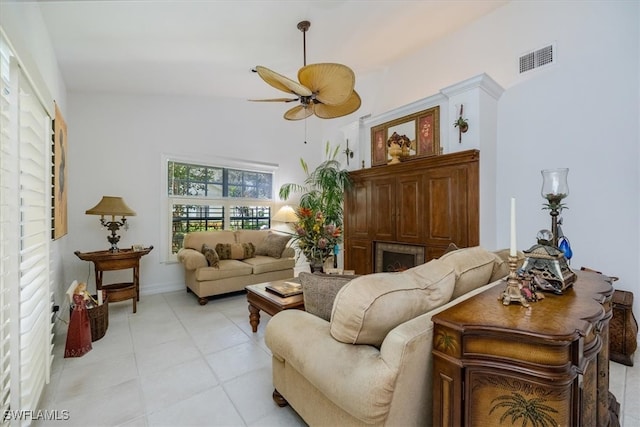 living room featuring vaulted ceiling and ceiling fan