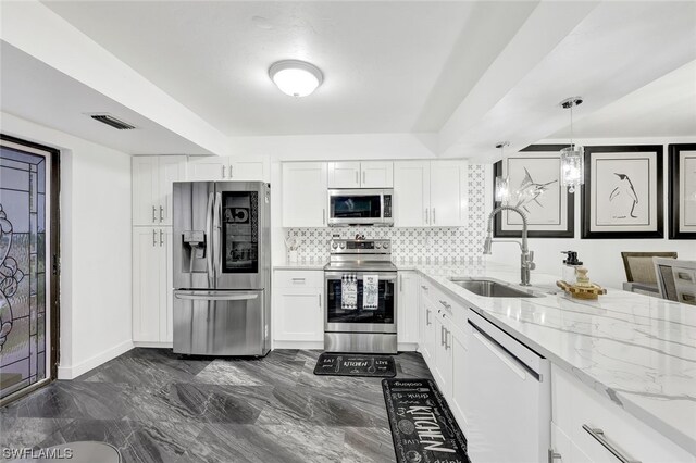 kitchen featuring white cabinets, sink, and stainless steel appliances