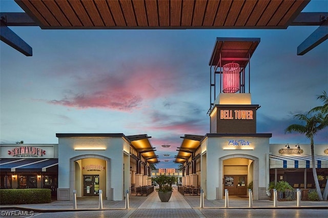 view of outdoor building at dusk