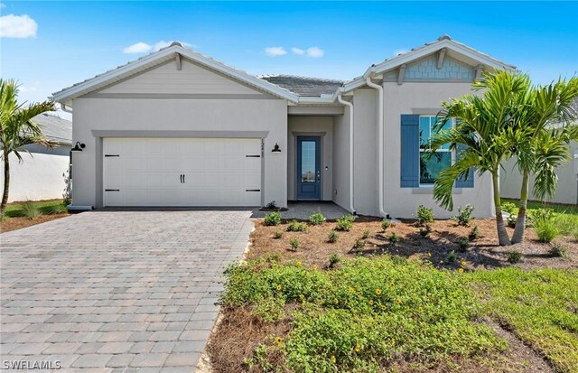 view of front of property with a garage