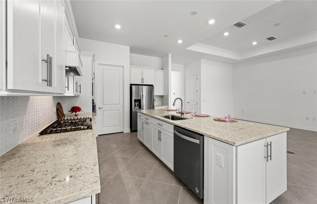 kitchen with white cabinetry, sink, an island with sink, and stainless steel appliances