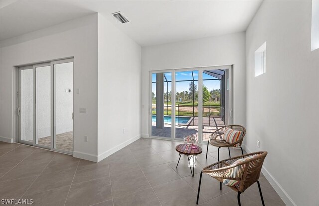 living area featuring tile patterned floors