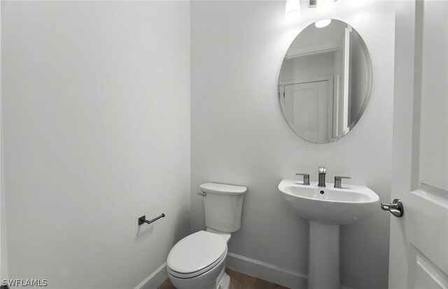 bathroom with toilet and sink