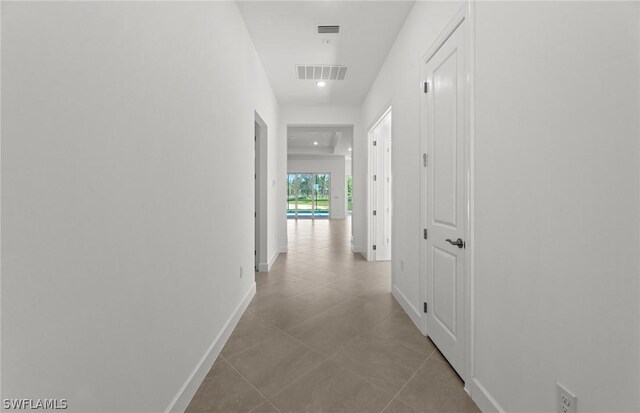 hallway featuring light tile patterned flooring