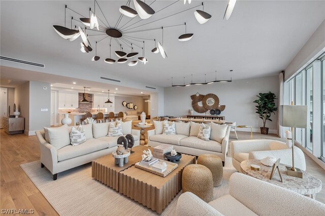 living room with light hardwood / wood-style flooring