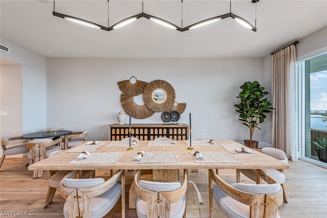 dining room with light wood-type flooring