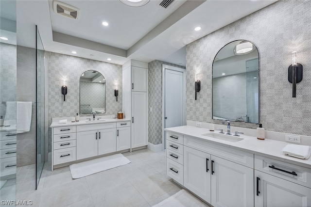 bathroom featuring an enclosed shower, tile floors, and double vanity