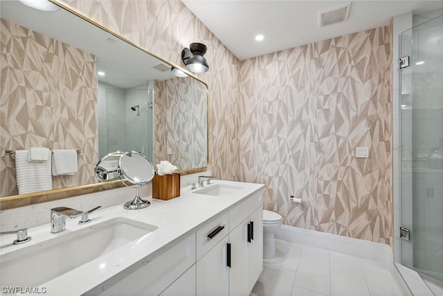 bathroom with walk in shower, toilet, tile floors, and dual vanity