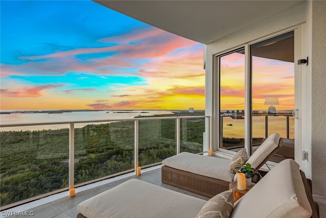 balcony at dusk with a water view