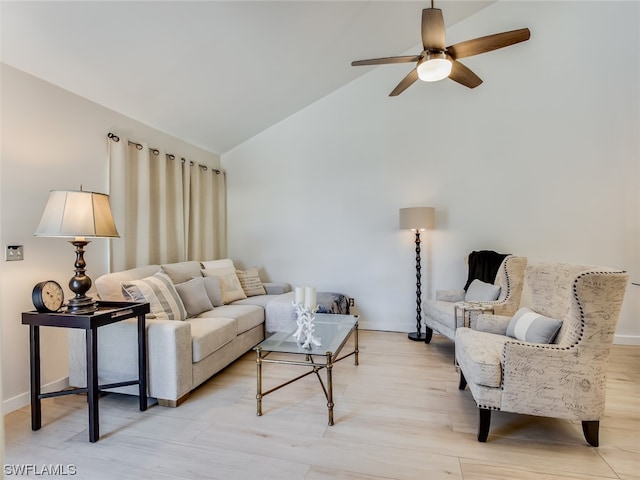 living room featuring high vaulted ceiling, ceiling fan, and light hardwood / wood-style flooring