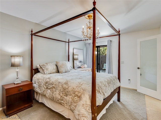 bedroom with light colored carpet and a chandelier