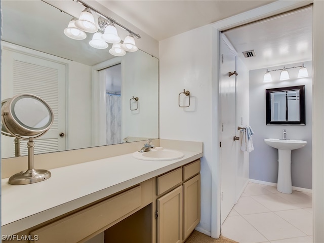 bathroom featuring tile floors and sink