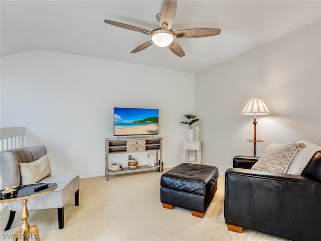 living area featuring light carpet and ceiling fan