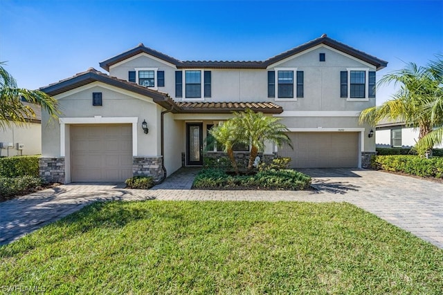 view of front facade featuring a front yard and a garage