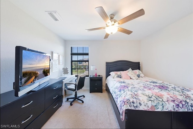 bedroom with light carpet and ceiling fan