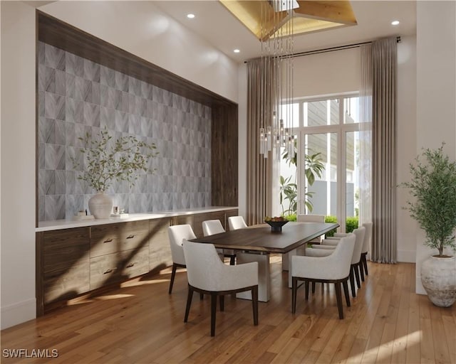 dining room with recessed lighting and light wood-style floors