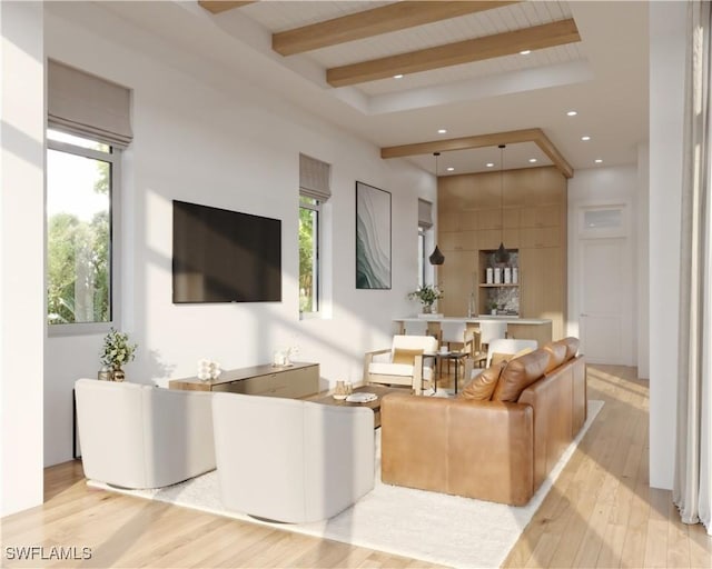 living area with light wood finished floors, beam ceiling, and recessed lighting