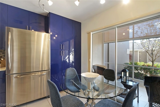 dining room featuring light tile floors