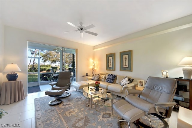 living room with light tile floors and ceiling fan