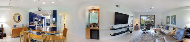 living room featuring light tile floors, wine cooler, and ceiling fan